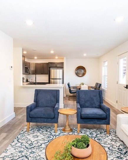 A bright living room inside a unit at Evergreen Estates, a 12-unit multi-family community built by Greenhouse Construction on E 5th St in Sheridan, Wyoming